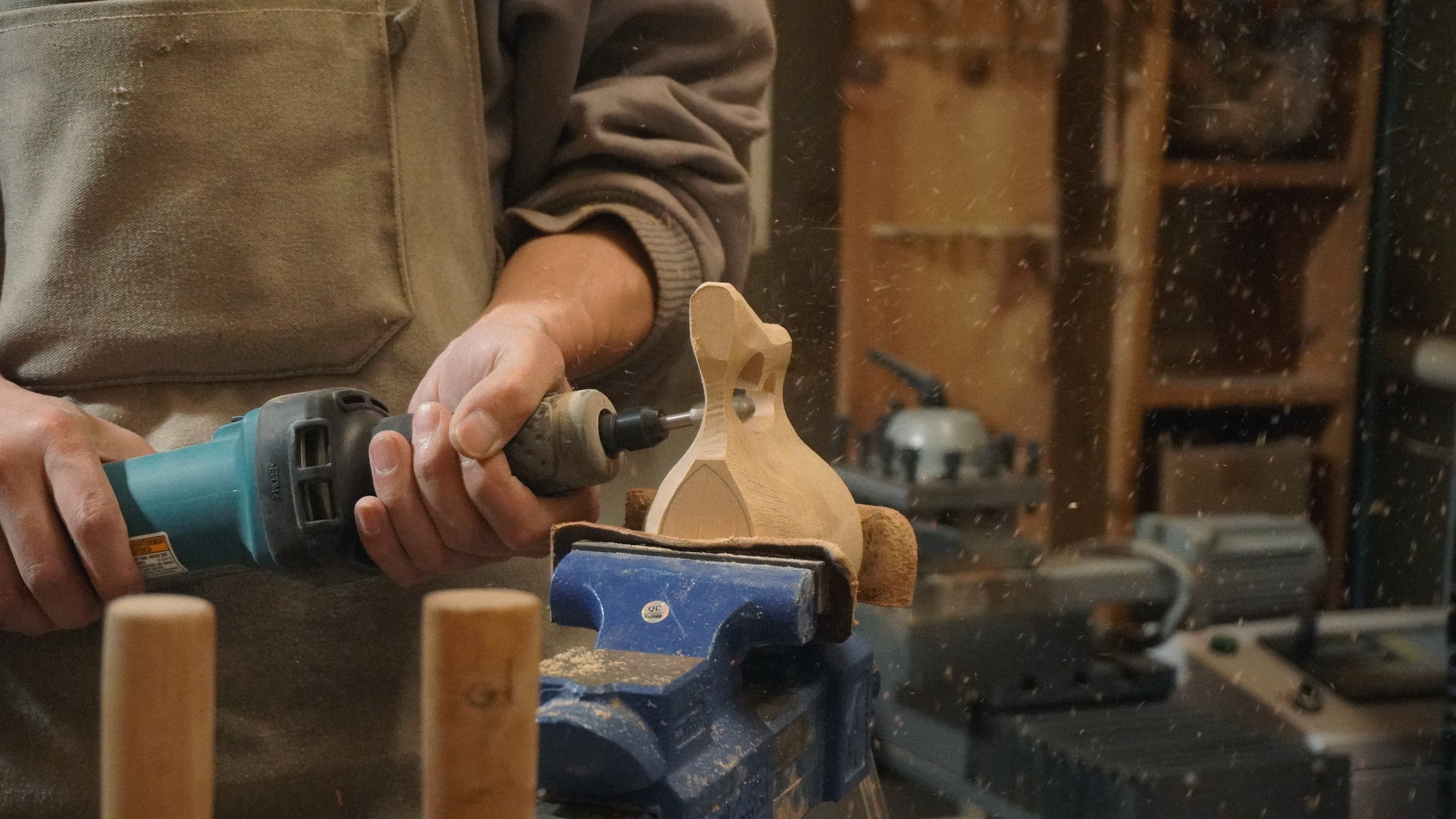 Artisan shaping a kuksa in the workshop
